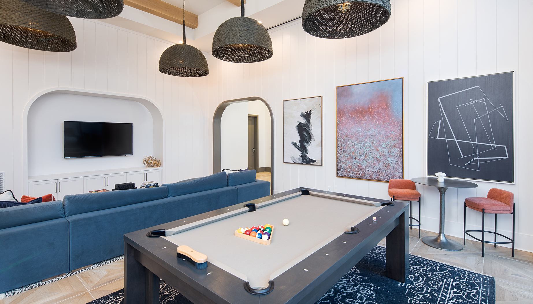 Vine North Hills clubroom with pool table and large blue couch