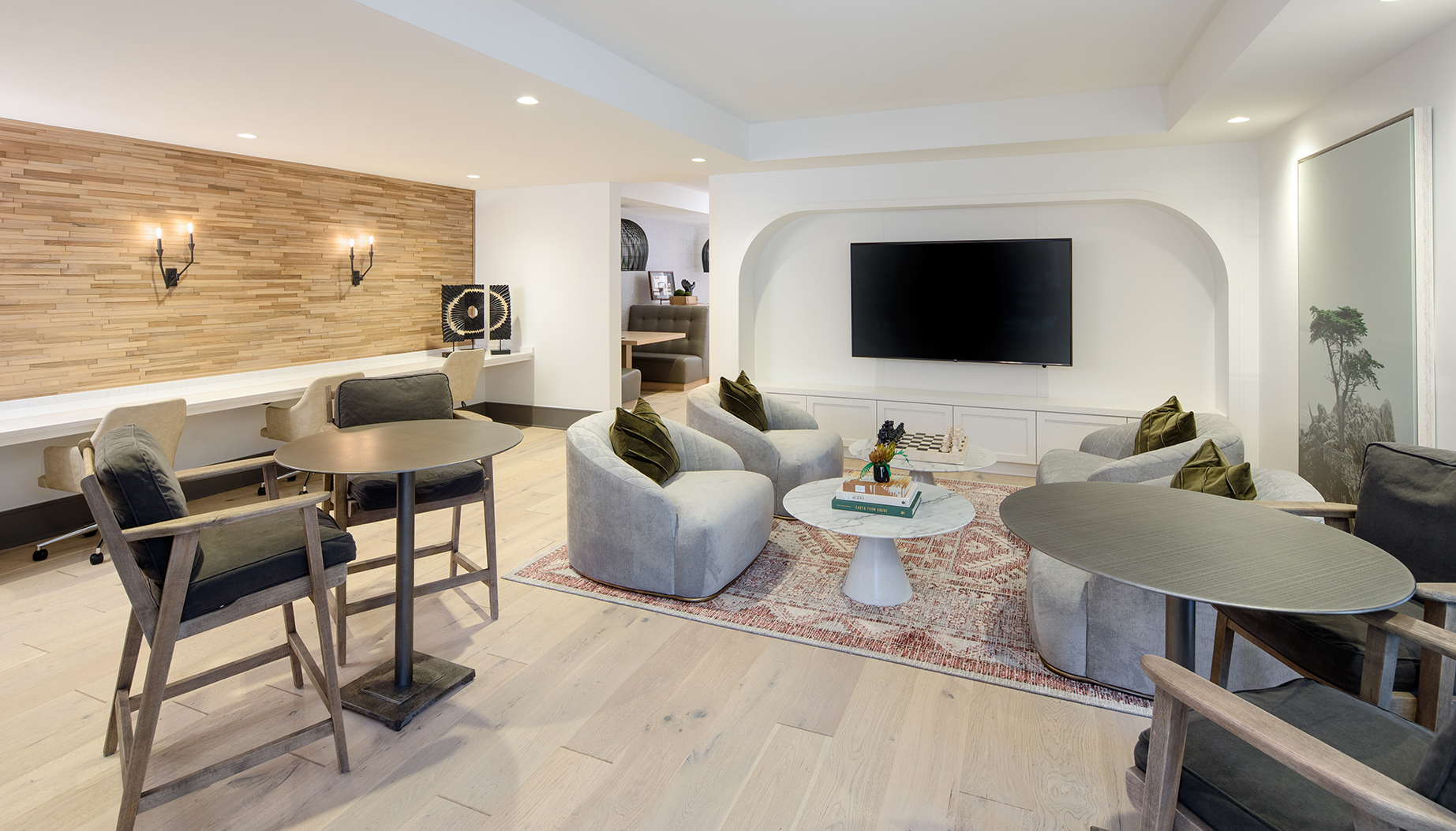Vine North Hills remote work center with seating and TV