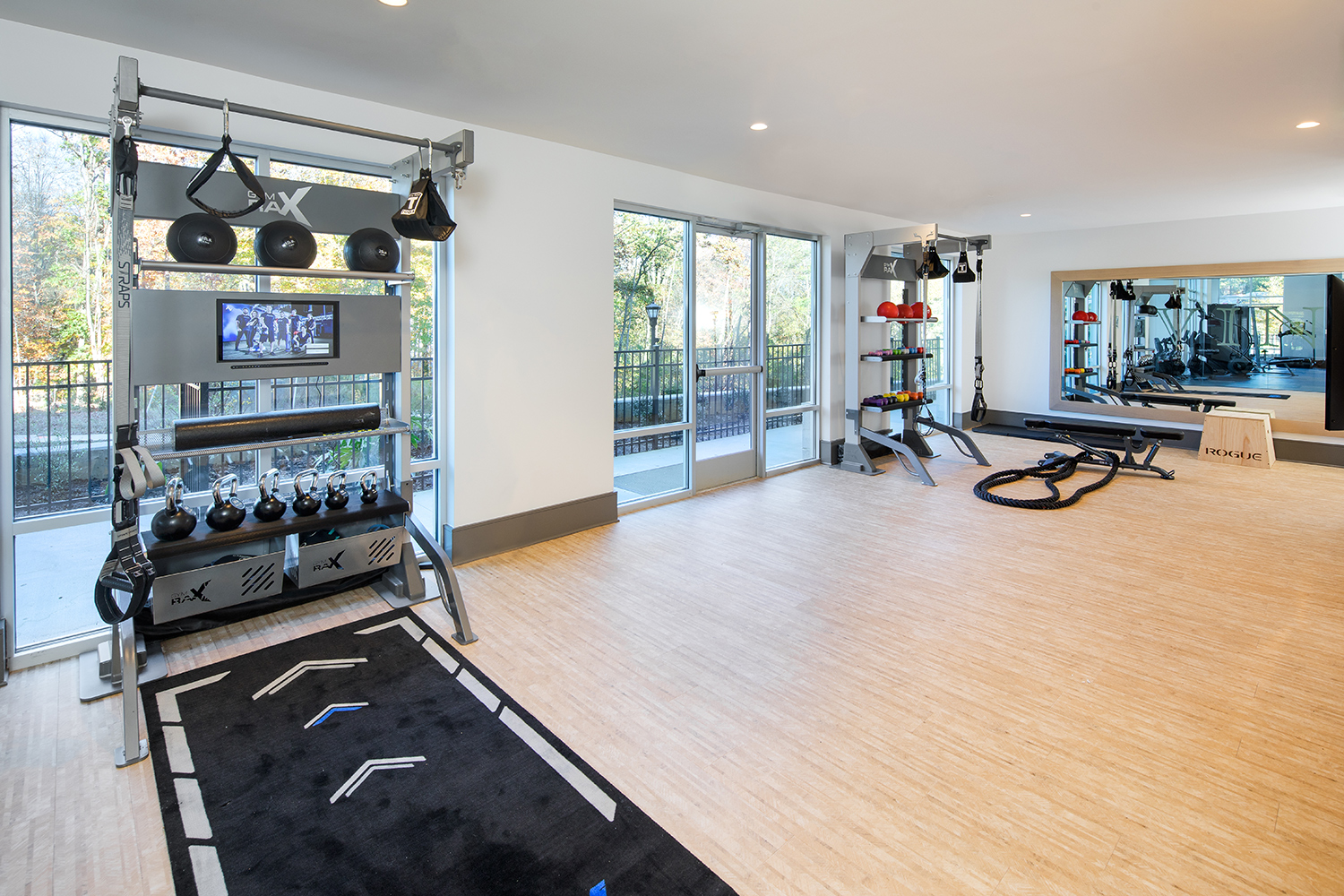 Vine North Hills fitness center with equipment and wooden flooring