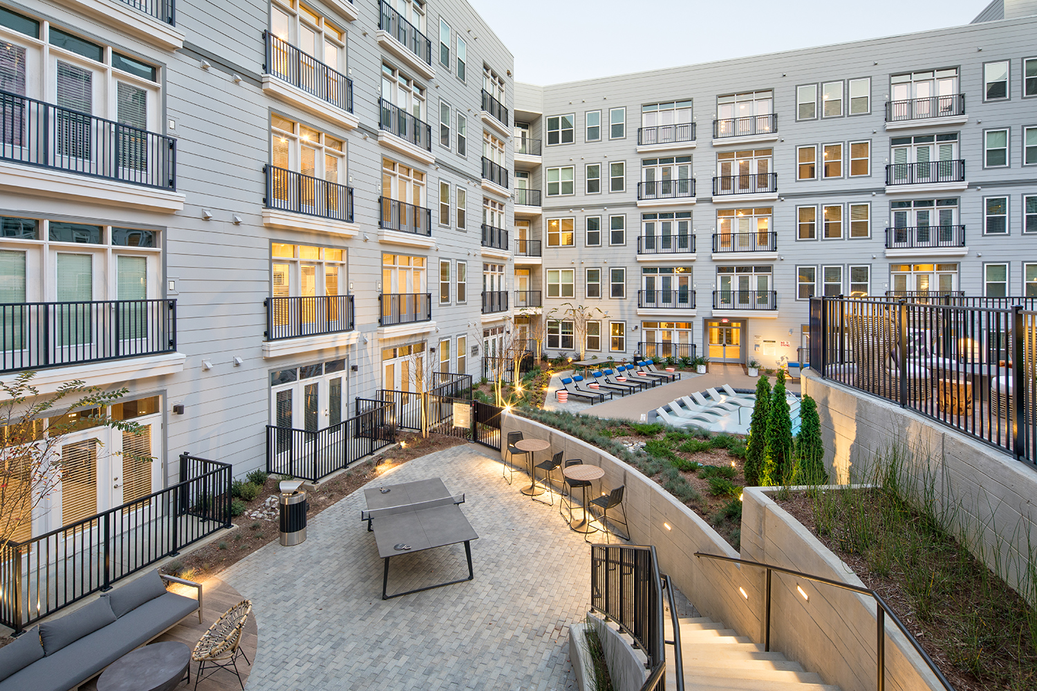 Vine North Hills courtyard view of the pool and surrounding area: ping pong table and stairs