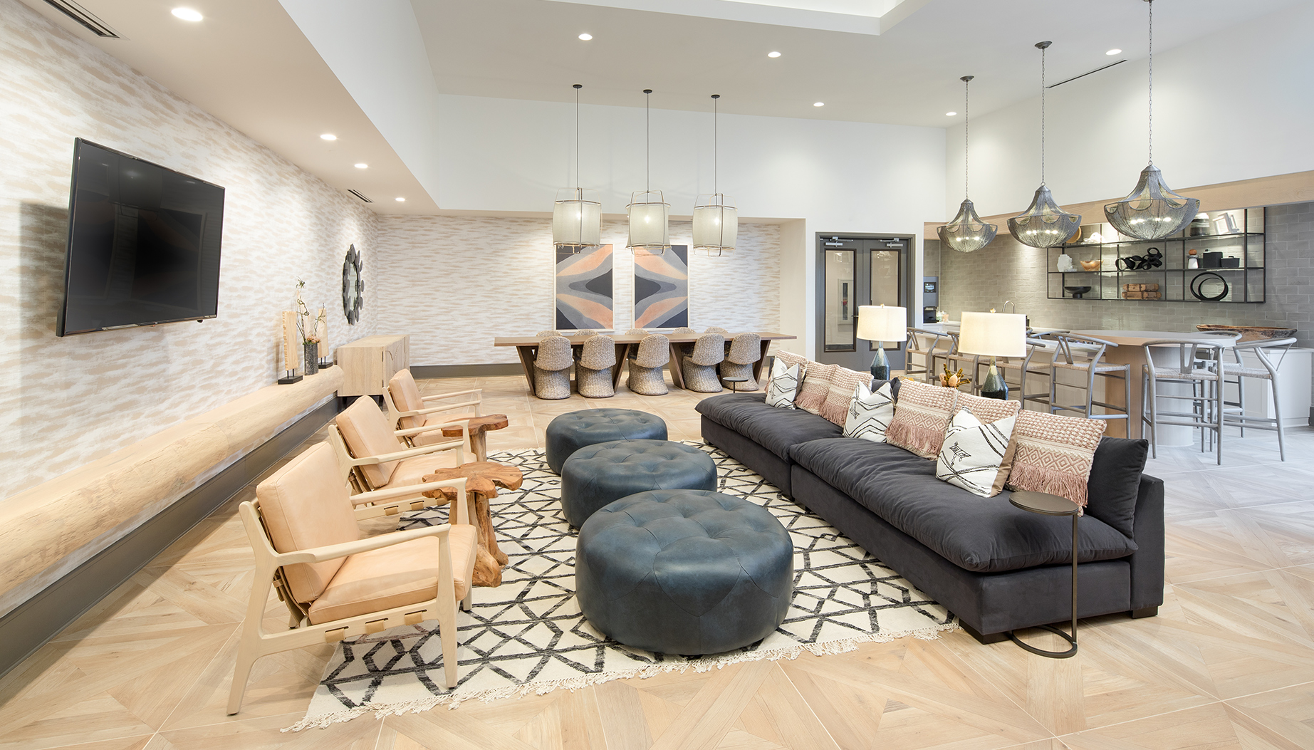 Vine North Hills clubroom with multiple seating and desk options and TV