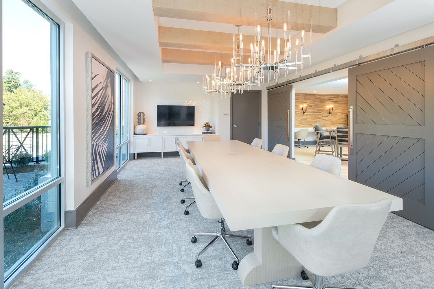 Vine North Hills conference room with farmhouse sliding doors and large conference desk and TV